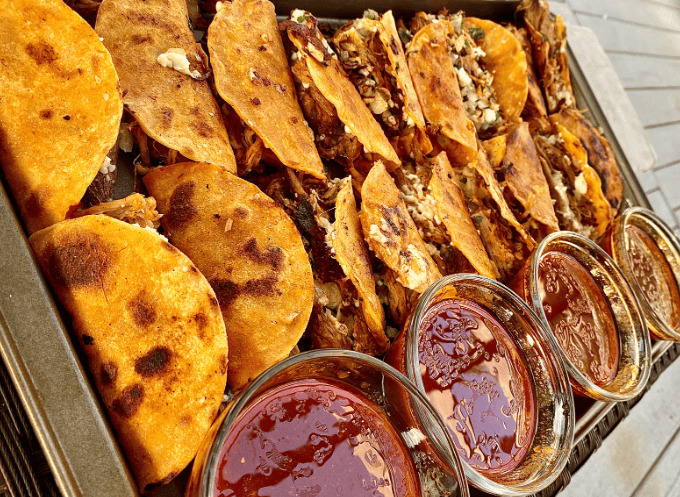 Authentic Birria Tacos Gardenfrontier A plate of delicious birria tacos with a bowl of rich consomme dipping broth