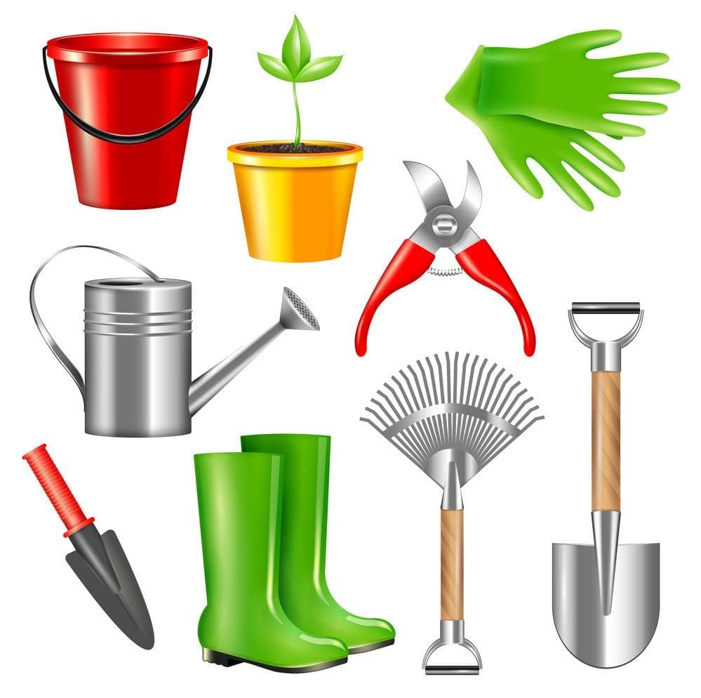 An assortment of essential Garden Tools Gardenfrontier A collection of essential garden tools including a trowel fork and gloves laid out on wood