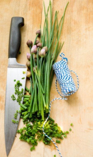 Finely Chopped Chives Gardenfrontier A pile of finely chopped bright green fresh chives ready for cooking