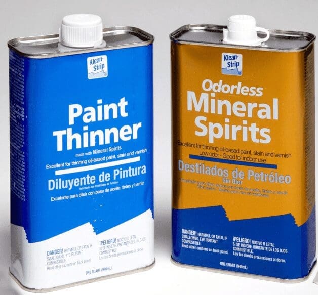 Mineral Spirits Gardenfrontier A bottle of mineral spirits sitting next to a paint brush